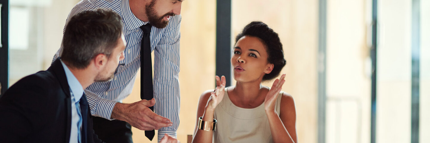 three business people in a meeting