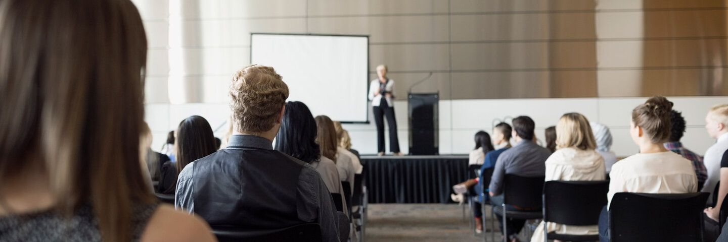 students sitting for a presentation