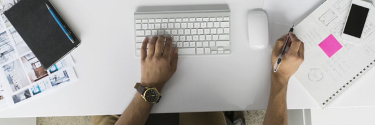 overhead view of someone on an apple computer