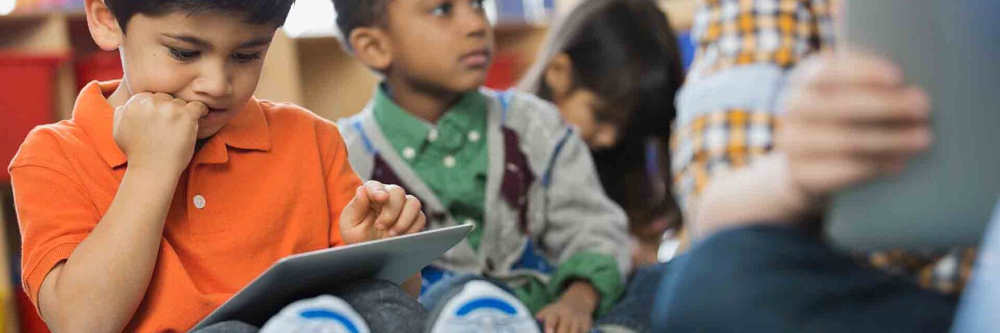 children using tablets in elementary school
