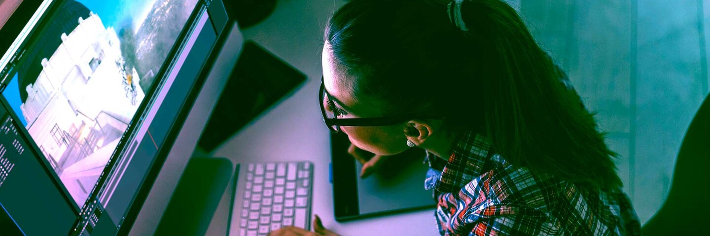woman working on computer making video graphics