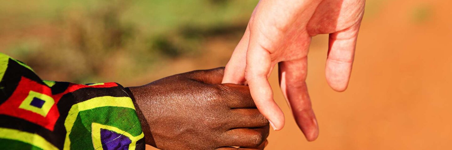Black and white holding hands