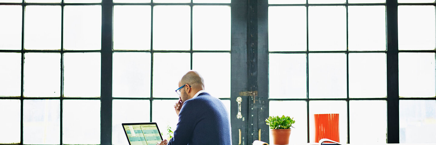 man working on his laptop at the office