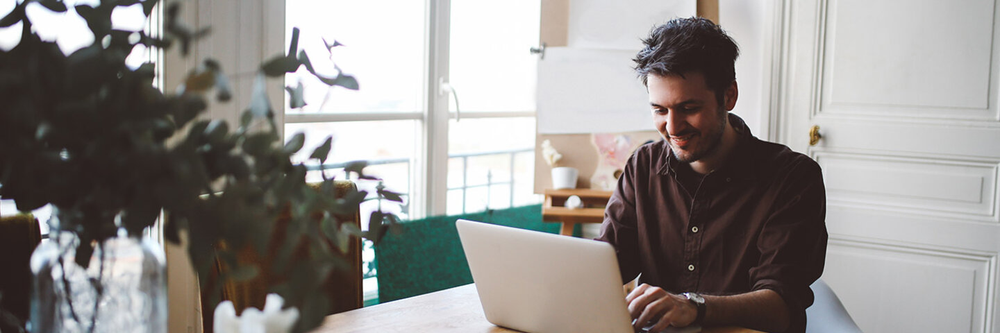 writer working at his kitchen table