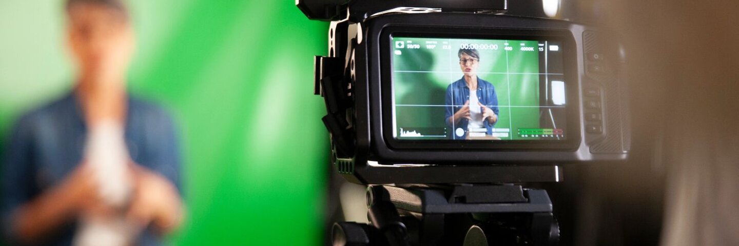 Professional video camera filming an interview