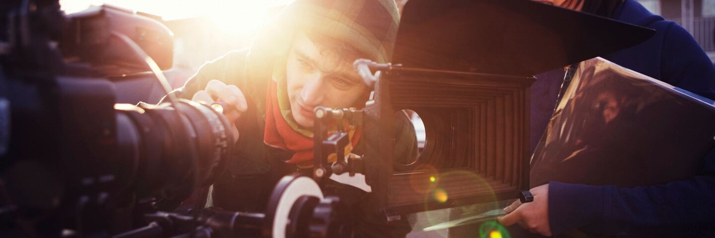 two students filming on set